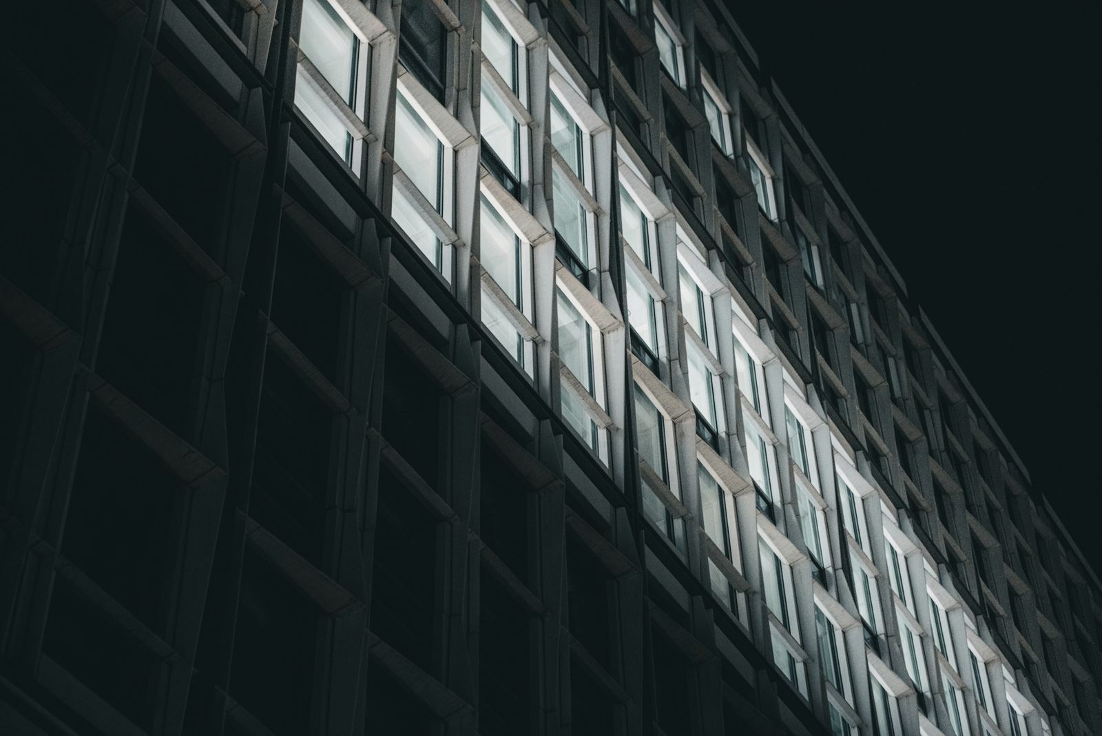Illuminated smart building facade at night