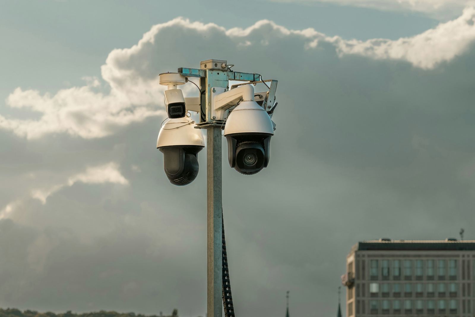 Security camera mounted on a building facade
